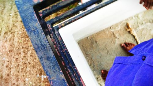 High angle view of man holding paper