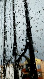 Full frame shot of raindrops on water