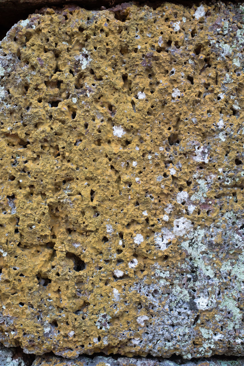 FULL FRAME SHOT OF STONE WALL WITH ROCKS