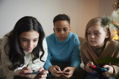 Children playing video games at home