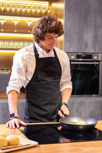 Man preparing food in kitchen