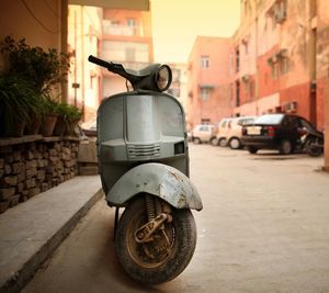 Motor scooter parked on footpath