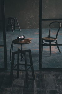 Empty chairs and table on floor