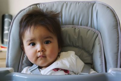 Portrait of cute girl sitting