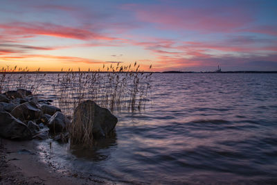 Scenic view of sea against sky during sunset