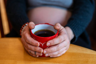 Close-up of woman drinking coffee cup