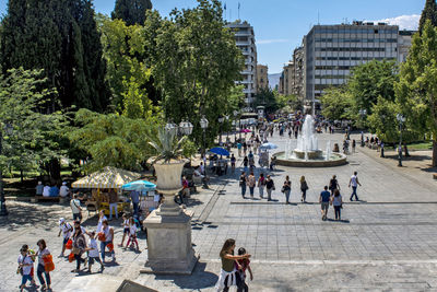 People walking on street in city