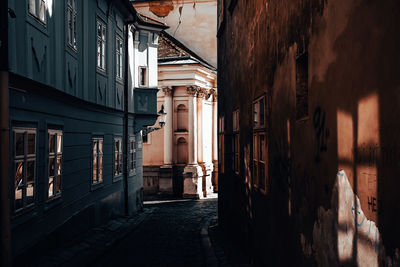 Narrow alley amidst buildings in city