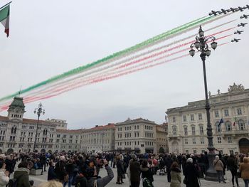 People at town square against sky