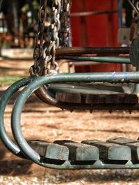 Close-up of empty swings at park
