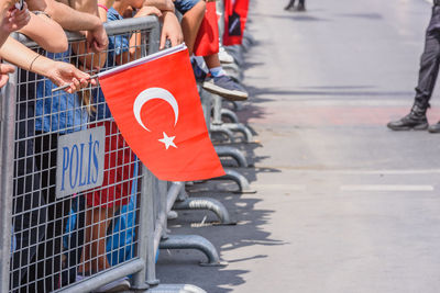 Low section of people walking on road