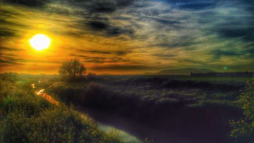 Scenic view of landscape at sunset