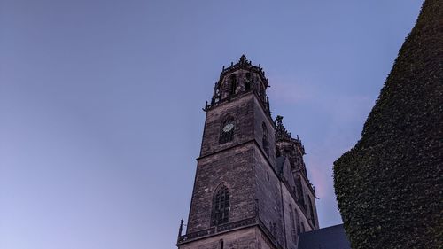 Low angle view of building against clear blue sky