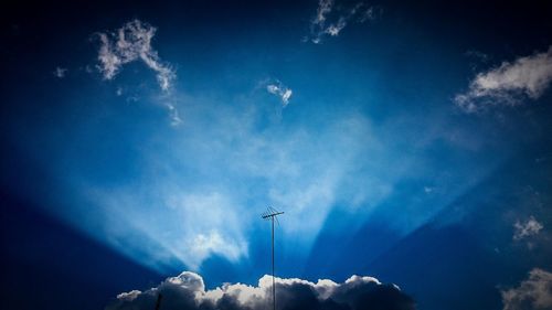 Low angle view of vapor trails in sky