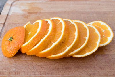 Close-up of orange slice on wood