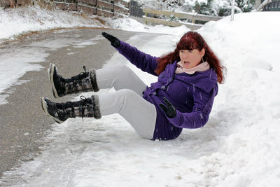 Woman on snow covered land