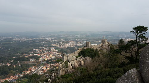 High angle view of castle on hill against sky