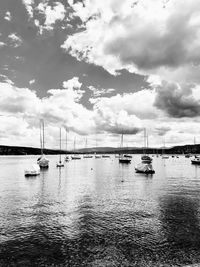 Sailboats on sea against sky