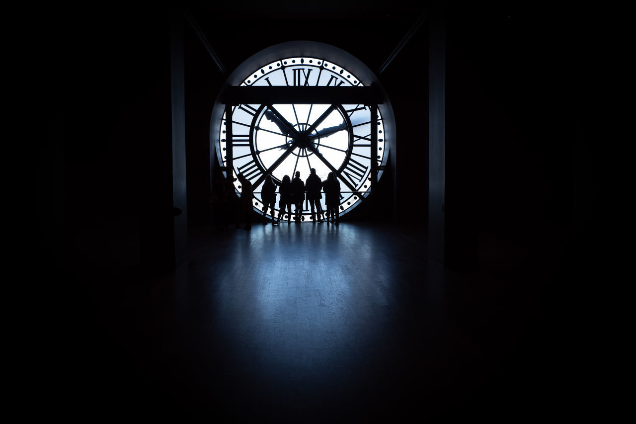 SILHOUETTE OF PEOPLE STANDING IN BUILDING