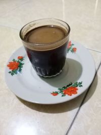 High angle view of coffee cup on table