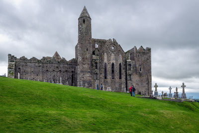 Historic building against cloudy sky