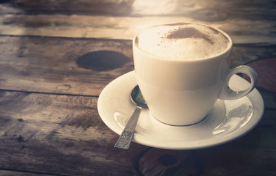 Close-up of coffee cup on table