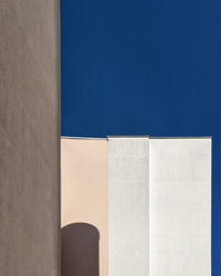 Low angle view of building against clear blue sky