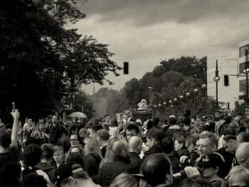 People in city against sky