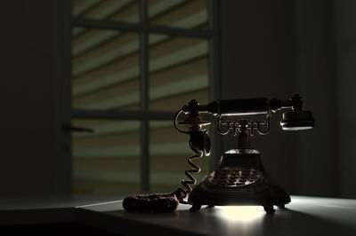 Close-up of old landline phone on table