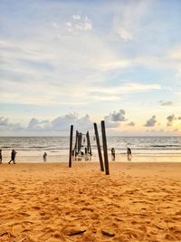 Scenic view of beach against sky during sunset