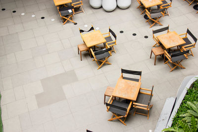 High angle view of chairs and table in restaurant