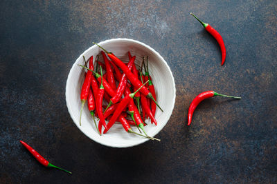 High angle view of red chili peppers in container