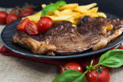 Close-up of roasted food in plate on table