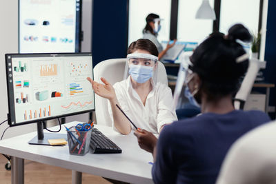 Midsection of woman working in laboratory