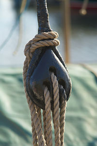 Close-up of rope tied on wooden post