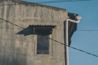 Low angle view of building against clear blue sky