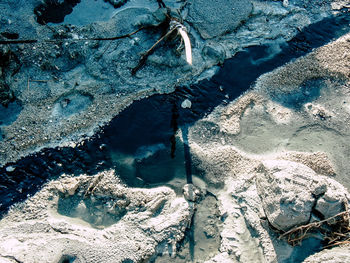 High angle view of rocks by sea