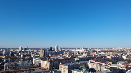 High angle shot of townscape against clear blue sky