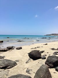 Scenic view of beach against clear sky