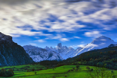 Scenic view of snowcapped mountains against sky