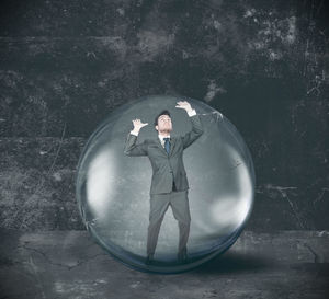 Digital composite image of man with umbrella