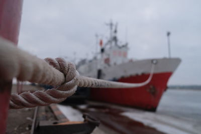 Close-up of sailboat on sea against sky