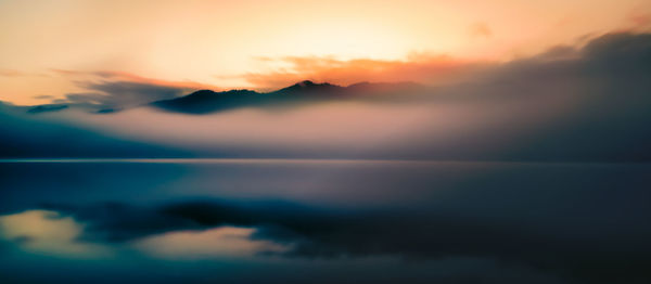 Scenic view of dramatic sky during sunset