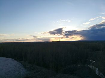 Scenic view of field against sky during sunset