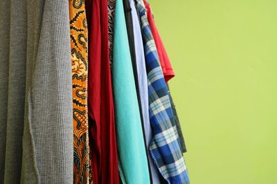 Close-up of multi colored clothes hanging on display at store