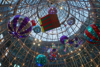 Low angle view of illuminated christmas lights at amusement park