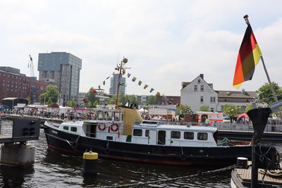 Boats moored at harbor