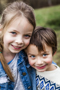 Portrait of smiling girl with brother