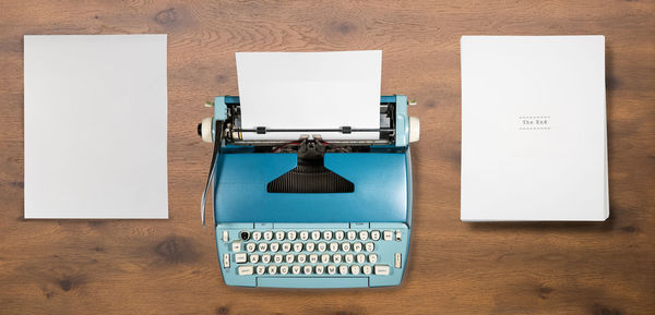 High angle view of text on paper at table