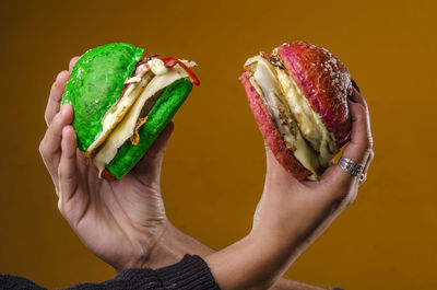 Cropped hand of woman holding food